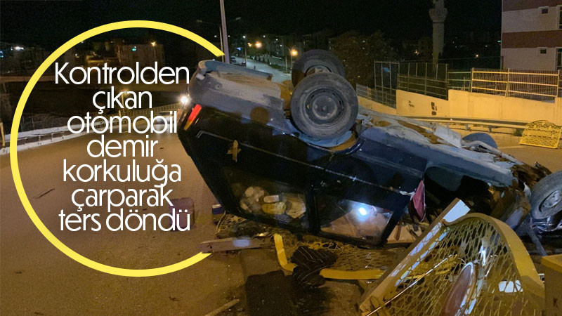 Kontrolden çıkan otomobil demir korkuluğa çarparak ters döndü